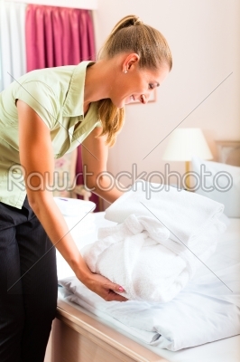 Maid doing room service in hotel