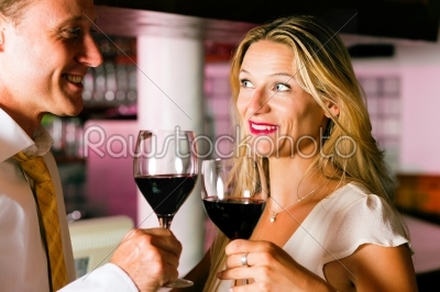 Man and woman flirting in hotel bar