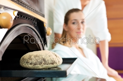 Man and woman in a bread sauna