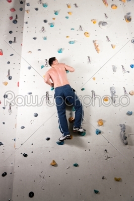 Man at the climbing wall 