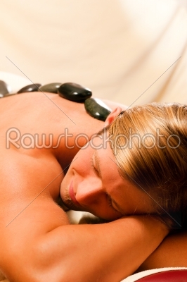 man having a hot stone therapy session