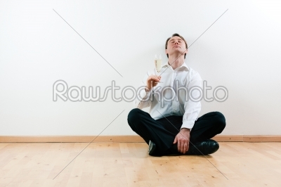 Man in apartment with champagne