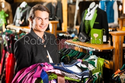 Man is buying Tracht or dirndl in a shop