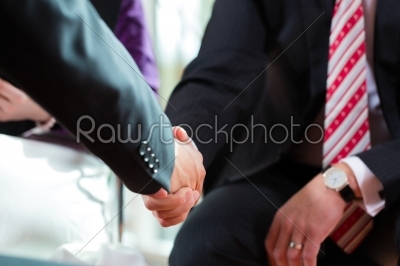 Man shaking hands with manager at job interview closeup cutout
