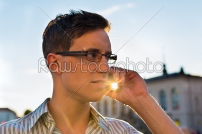 Man taking a call with mobile phone 