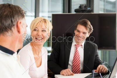 Mature couple with financial consultant
