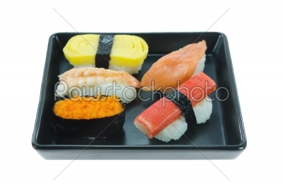 mix sushi on black plate