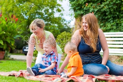 Mother and grandmother with children in a park