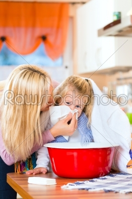 Mother care for sick child with vapor-bath