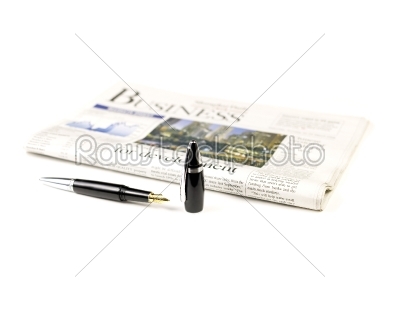 newspaper and pen