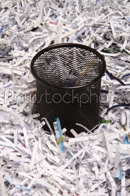 Office wastebasket and paper as background