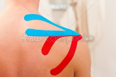 Patient at the physiotherapy with tape