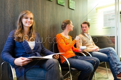 Patients in the waiting room of a doctors office
