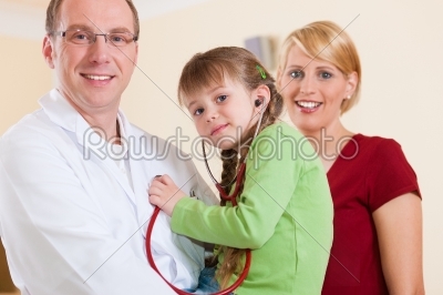 Pediatrician with family in his surgery
