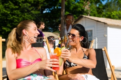 People at beach drinking having a party
