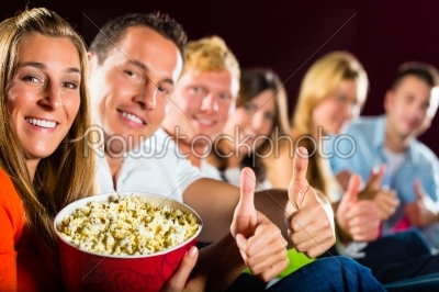 People see a movie in the cinema and have fun