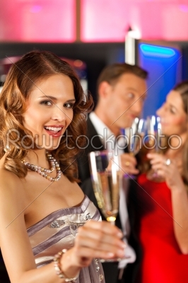 People with champagner in a bar