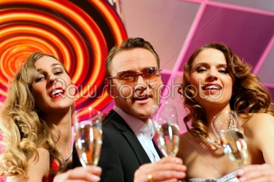 People with champagner in a bar