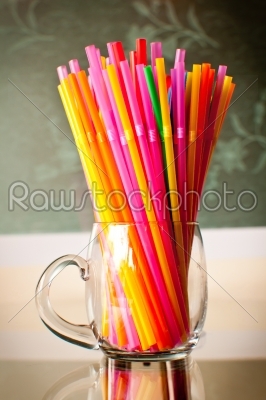 plastic straws in plexy glassware