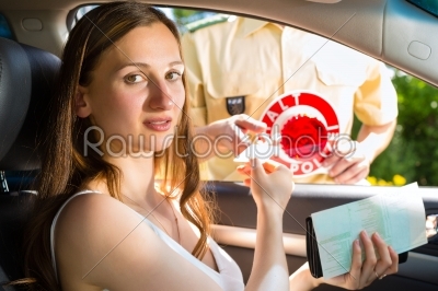 Police - woman in traffic violation getting ticket