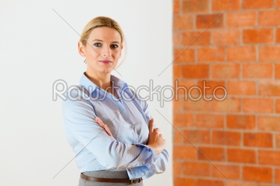 Realtor standing in empty apartment