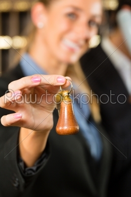 Reception in Hotel - woman with key