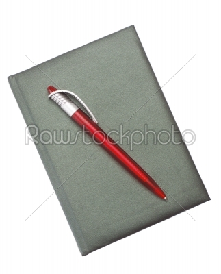 Red Pen on a dark notebook
