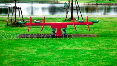 red spring seesaw