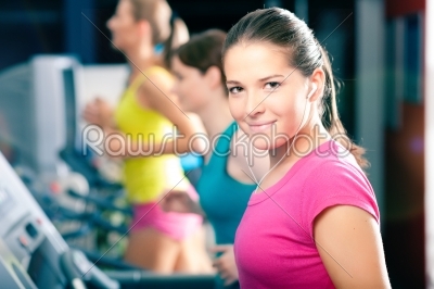 Running on treadmill in gym