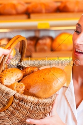 Salesperson with female customer in bakery