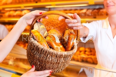 Salesperson with female customer in bakery