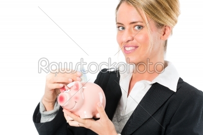Saving  money,  woman with a piggy bank