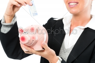 Saving  money,  woman with a piggy bank