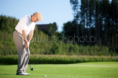 Senior golf player in summer