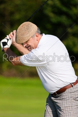 Senior golf player in summer