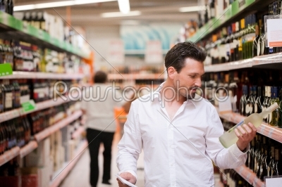 Shopper Holding Liquor Bottle