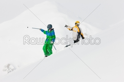 Skier and snowboarder in the snow