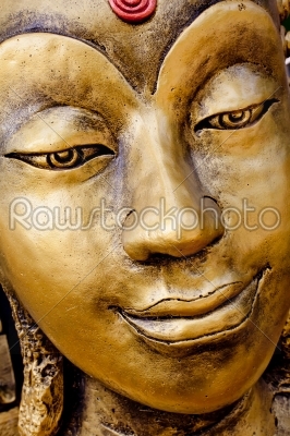 smile gold Buddha face
