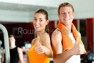 Sportive couple in gym