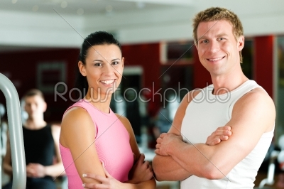Sportive couple in gym