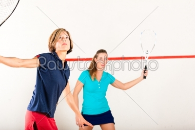 Squash racket sport in gym, women competition