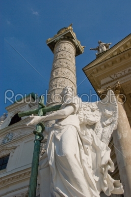Statue of an Angel with cross and snake