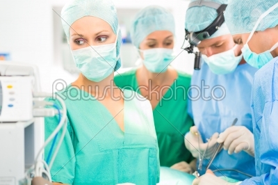 Surgeon doctors  working in operation theater
