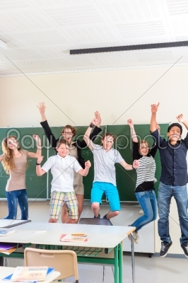 Teacher motivating students in school class