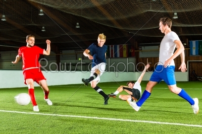 Team playing football or soccer indoor