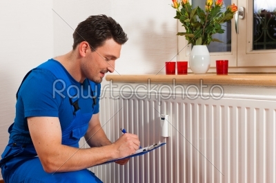 Technician reading the heat meter