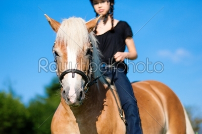 Teenage girl with horse