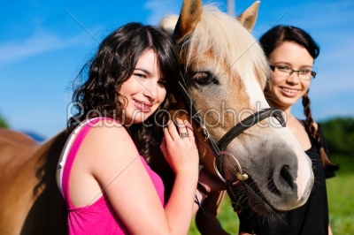 Teenage girls with horse