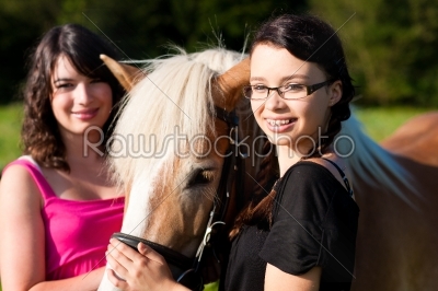 Teenage girls with horse