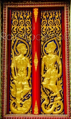 Thai panting of Wood door. In Thai Temple.